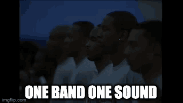 a group of men standing next to each other on a field with the words one band one sound on the bottom .