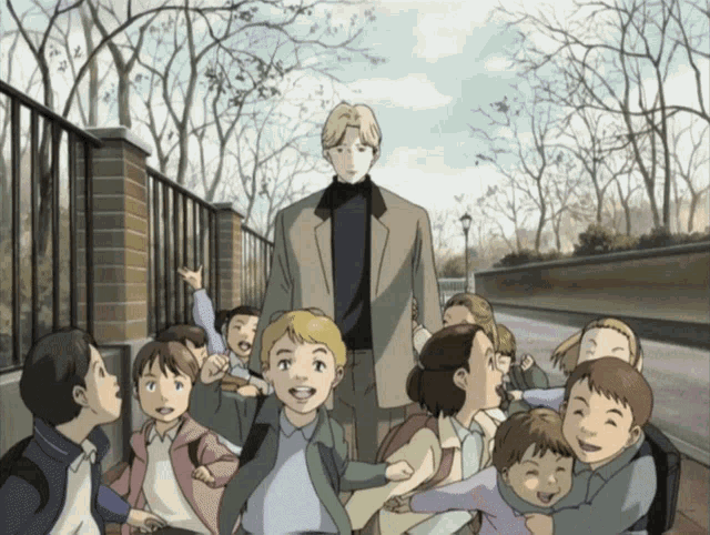a man in a suit is walking with a group of children